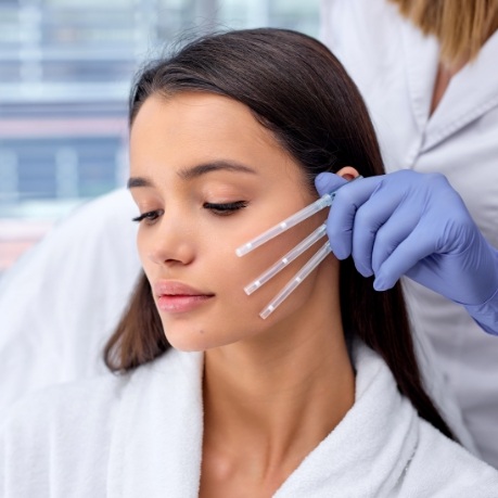 Cosmetic dentist preparing to give a patient a Botox injection