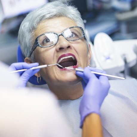 Senior woman receiving a dental exam