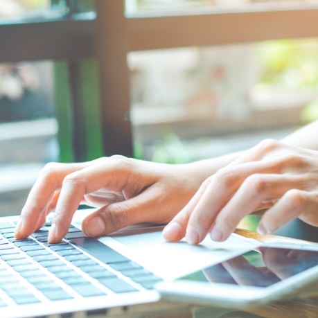 Person typing on laptop