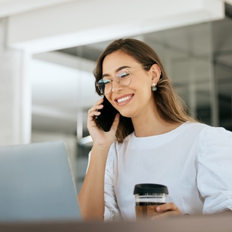 Smiling woman talking on phone