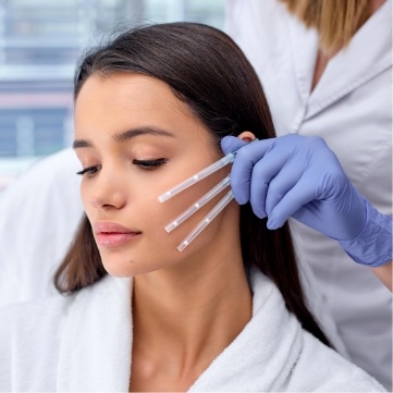 Woman preparing to receive a Botox injection from her dentist